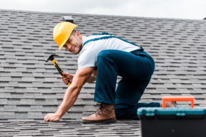 A man installing a new roof